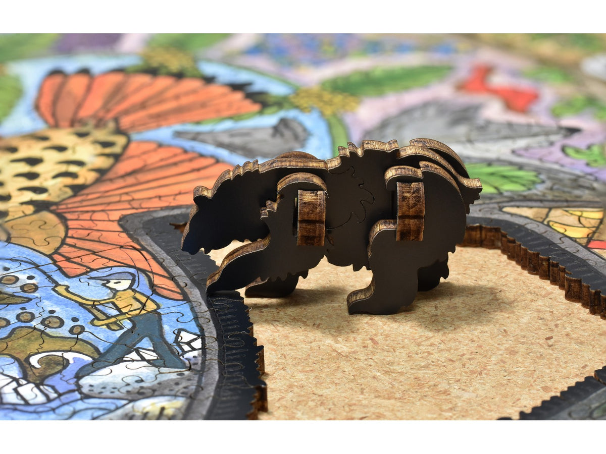 A closeup of pieces showing a three dimensional bear that can be made out of pieces in the puzzle, Black Bear.
