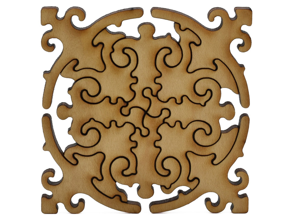 A closeup of pieces shaped like a large multi-piece mandala.