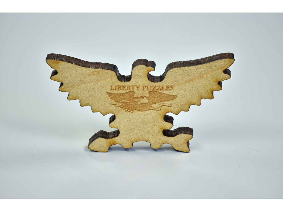 A closeup of a piece in the shape of an eagle.
