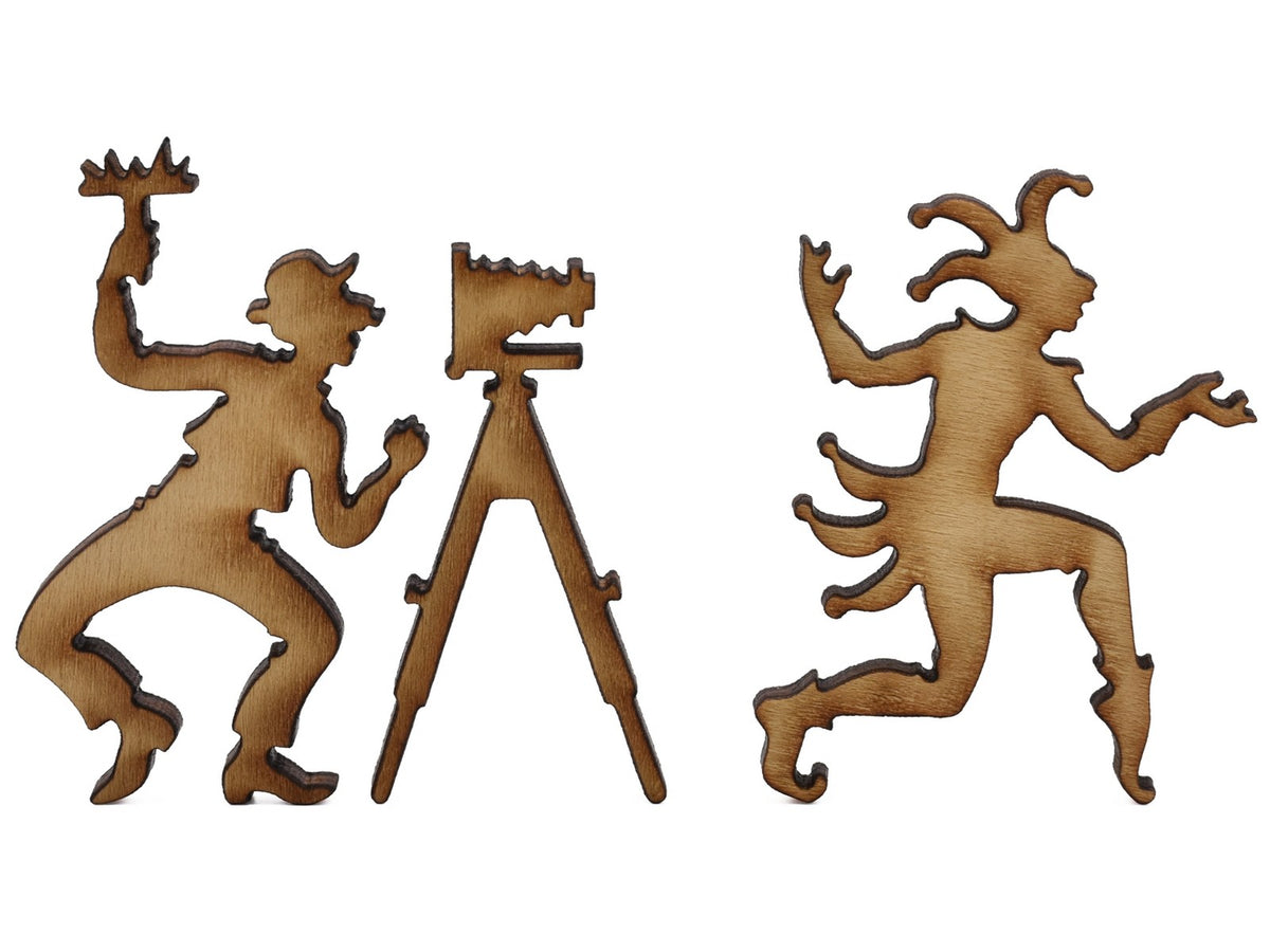 A closeup of pieces shaped like a photographer and a jester.
