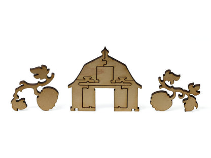 A closeup of pieces showing a barn and fruit on branches.