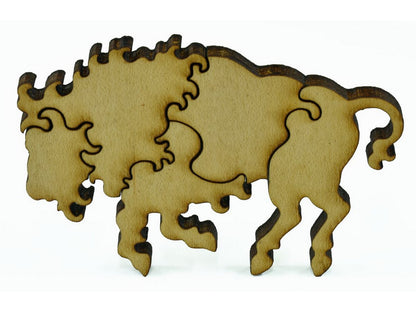 A closeup of pieces in the shape of a bison.
