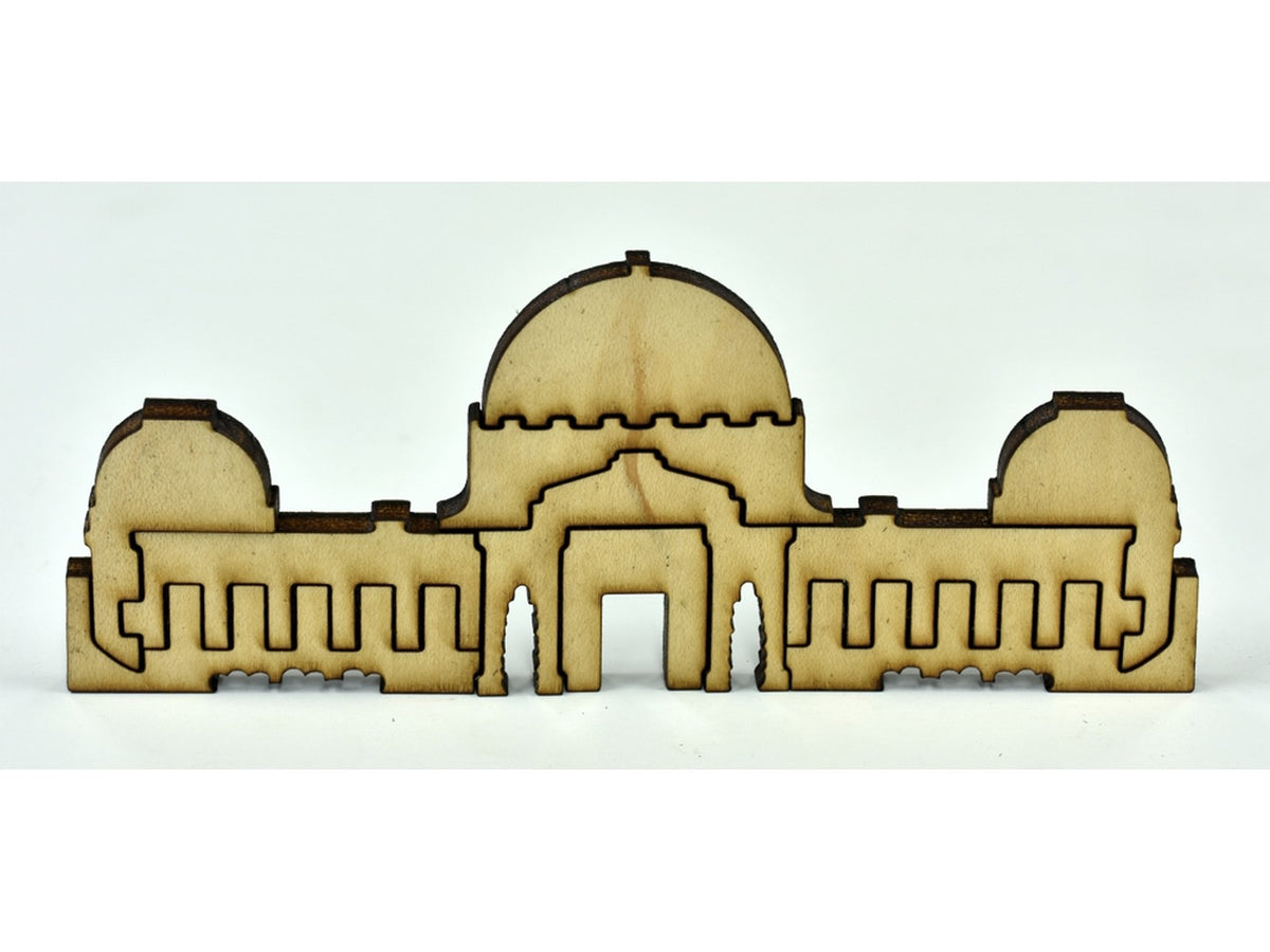 A closeup of pieces in the shape of a building.