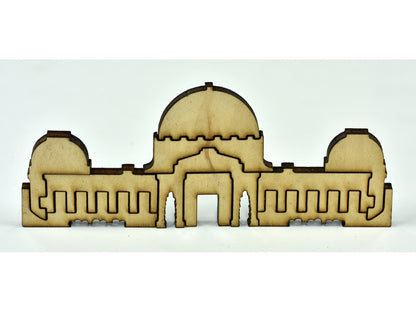 A closeup of pieces in the shape of a building.