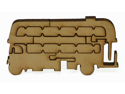 A closeup of pieces that make up a multi-piece double decker bus.