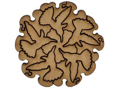 A closeup of pieces shaped like five hummingbirds in a circle pattern.