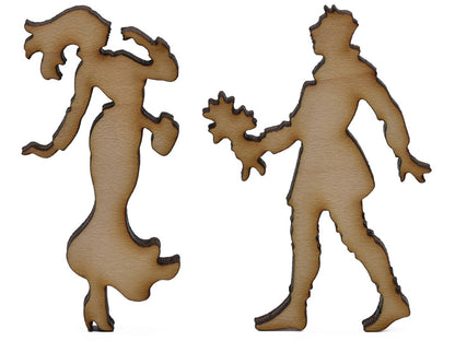 A closeup of pieces shaped like a couple with flowers.