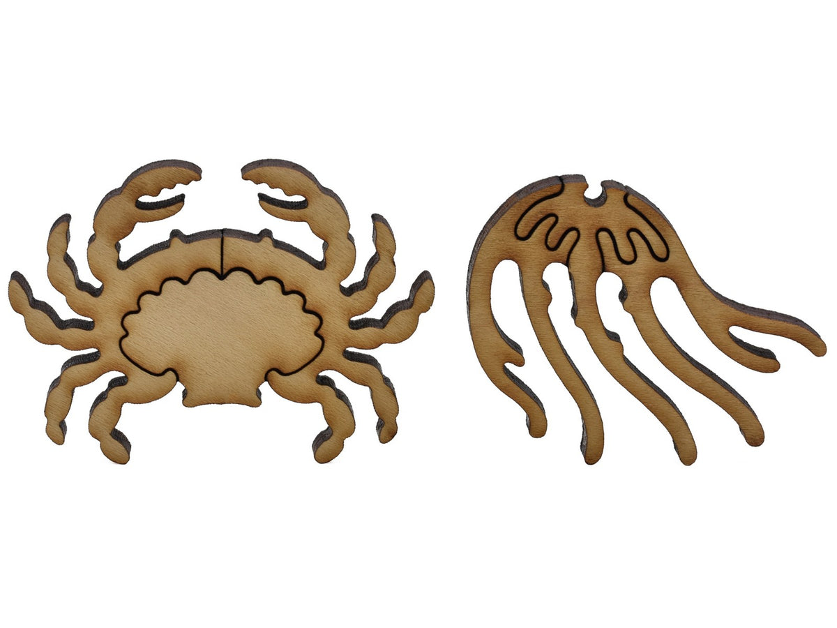A closeup of pieces shaped like a crab and a jellyfish.