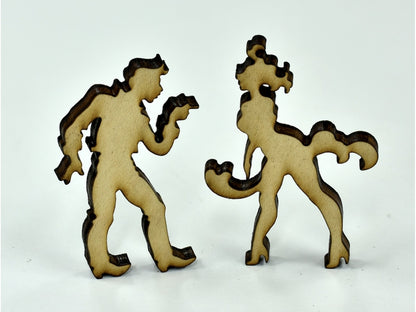 A closeup of pieces in the shape of two people dancing.