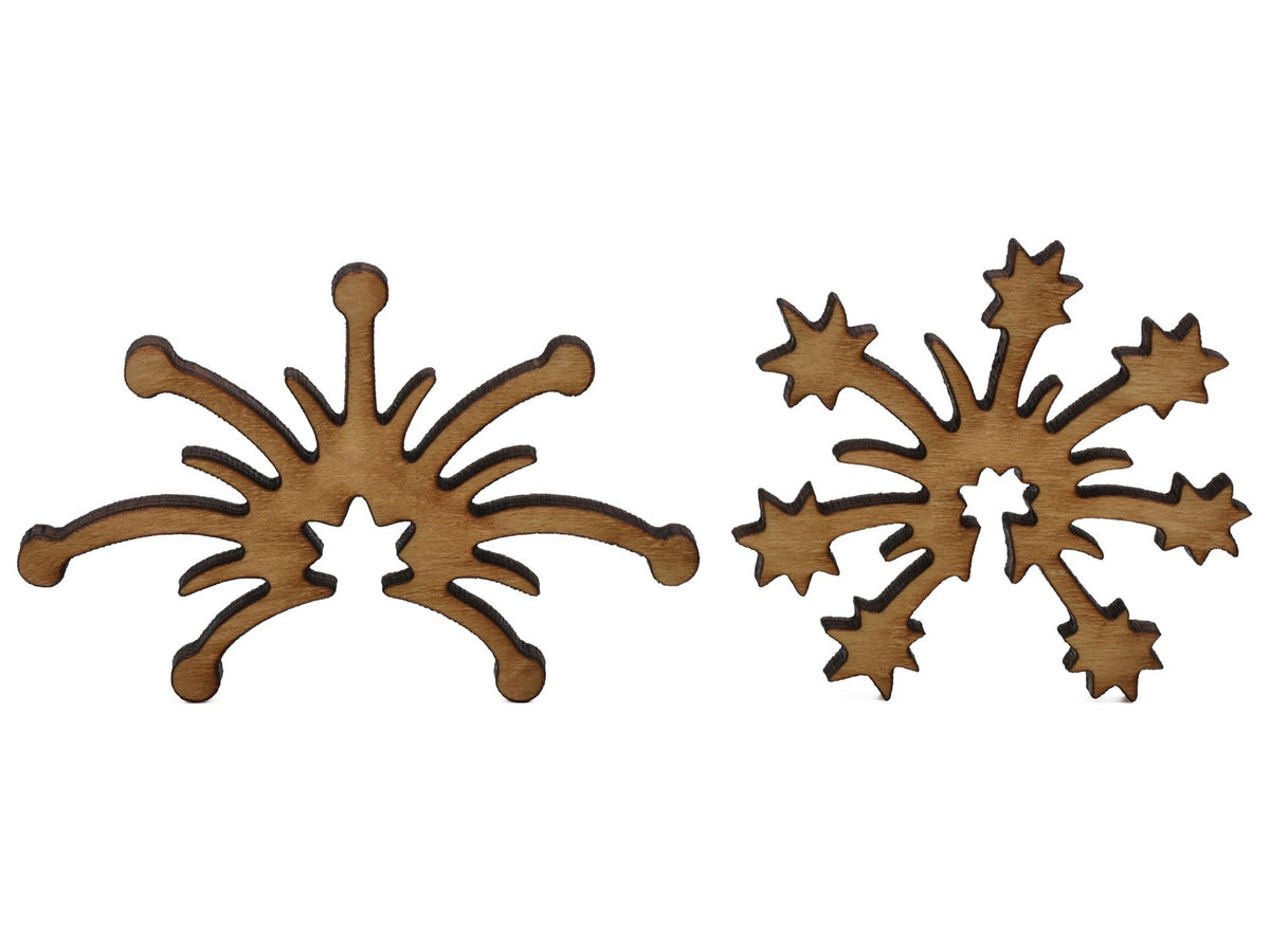 A closeup of pieces shaped like two fireworks exploding.