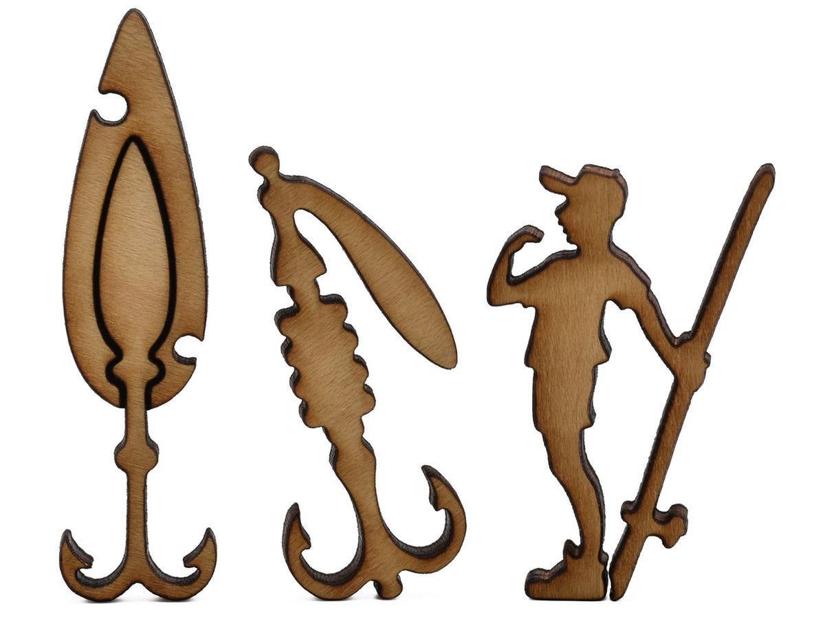 A closeup of pieces shaped like two fishing lures and a fisherman.