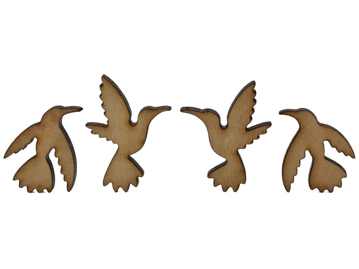 A closeup of pieces shaped like four hummingbirds.