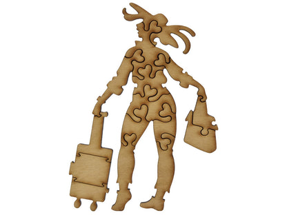 A closeup of pieces shaped like a large, multipiece woman with luggage.