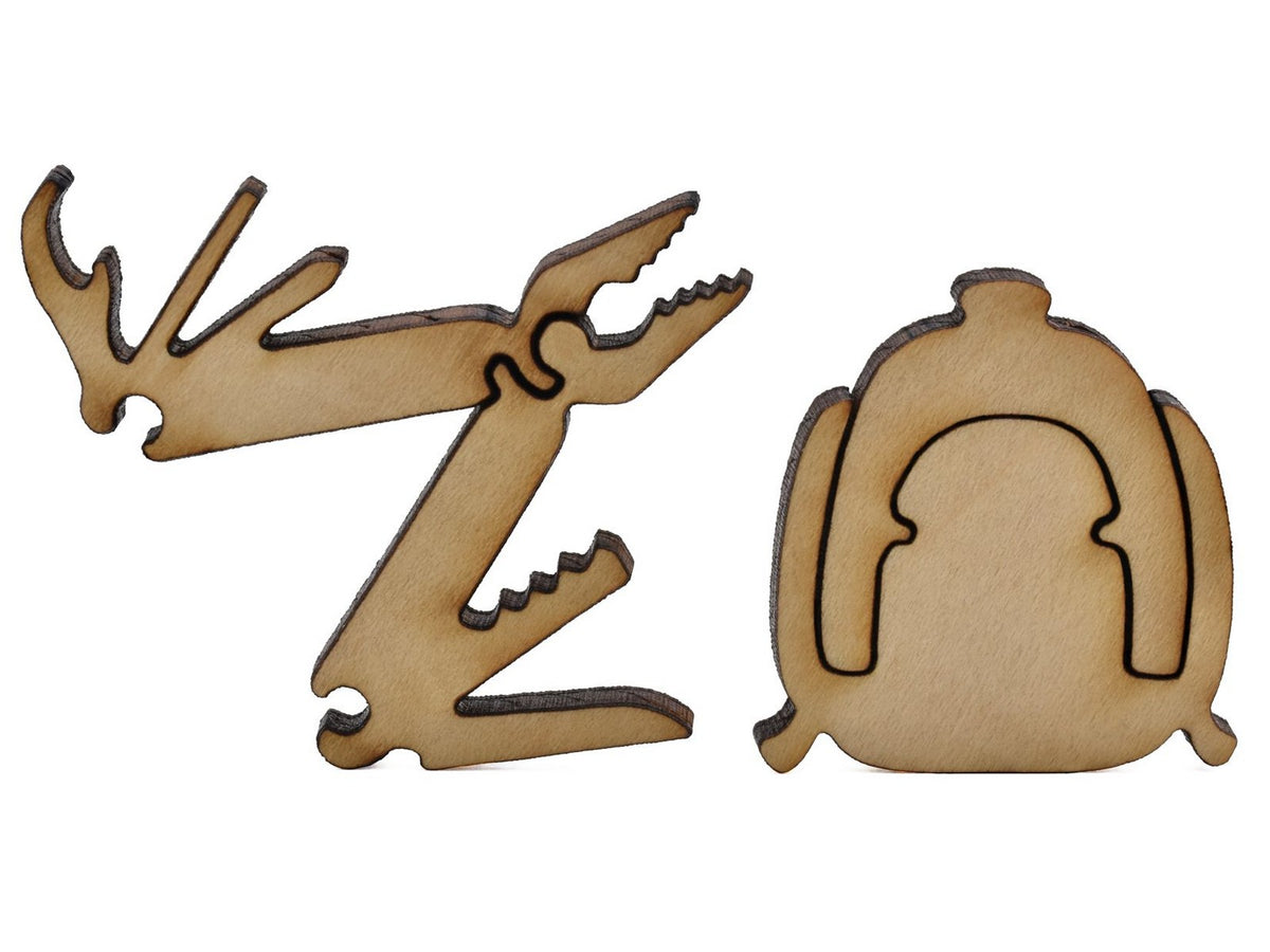 A closeup of pieces shaped like a Leatherman tool and a backpack.