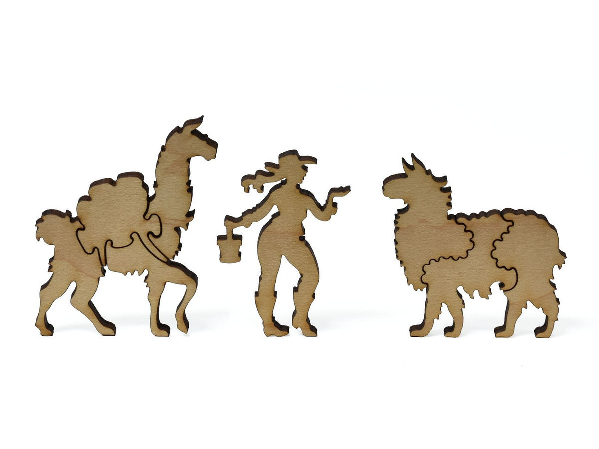 A closeup of pieces showing a woman with two llamas.