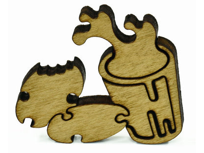 A closeup of pieces in the shape of cookies and milk.