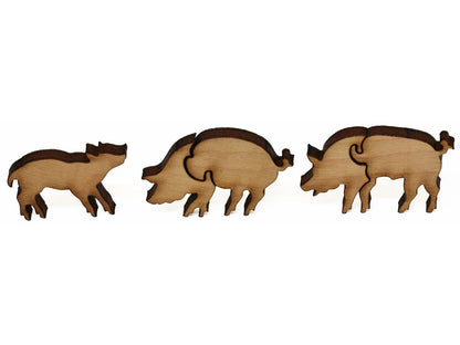 A closeup of pieces showing two pigs and a piglet.