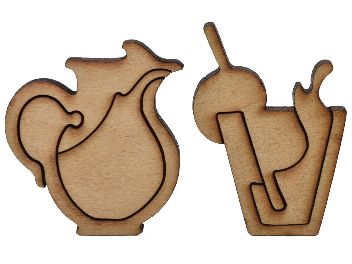A closeup of pieces shaped like a pitcher and a drink.