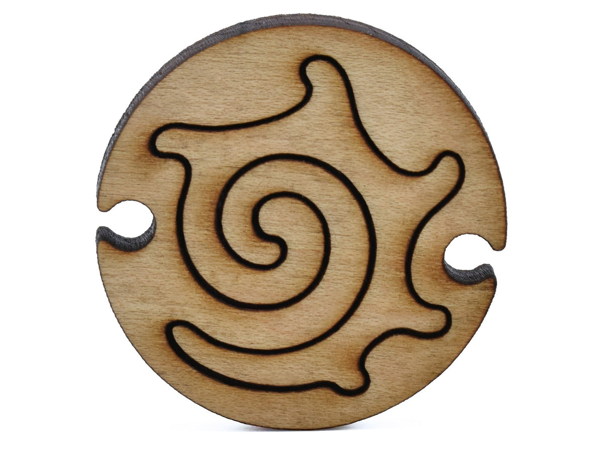 A closeup of pieces shaped like a round nautilus.