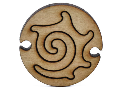 A closeup of pieces shaped like a round nautilus.