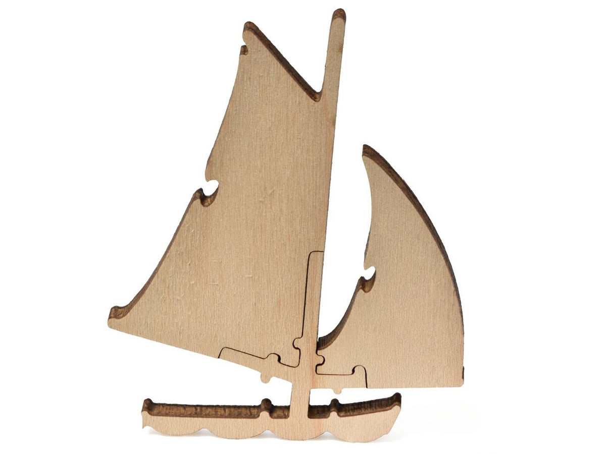 A closeup of pieces that show a sailboat from Monet's Sailboat at Le Petit Gennevilliers.