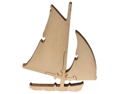 A closeup of pieces that show a sailboat from Monet's Sailboat at Le Petit Gennevilliers.