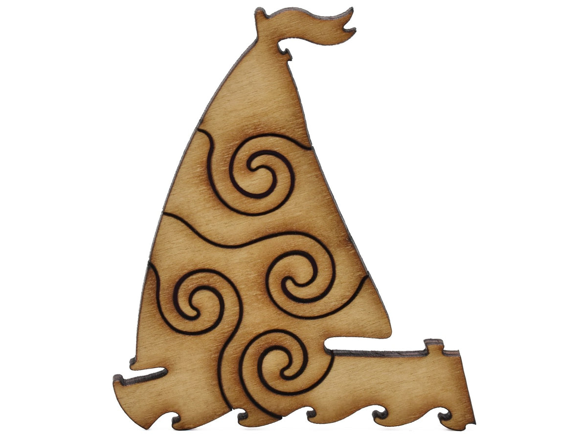 A closeup of pieces shaped like a sailboat.