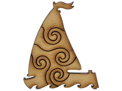 A closeup of pieces shaped like a sailboat.