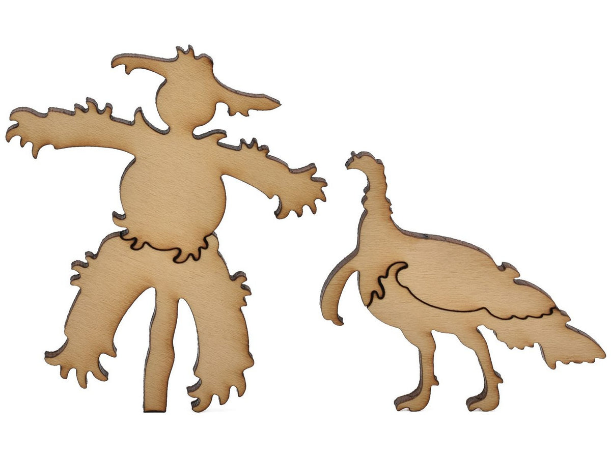 A closeup of pieces shaped like a scarecrow and a turkey.