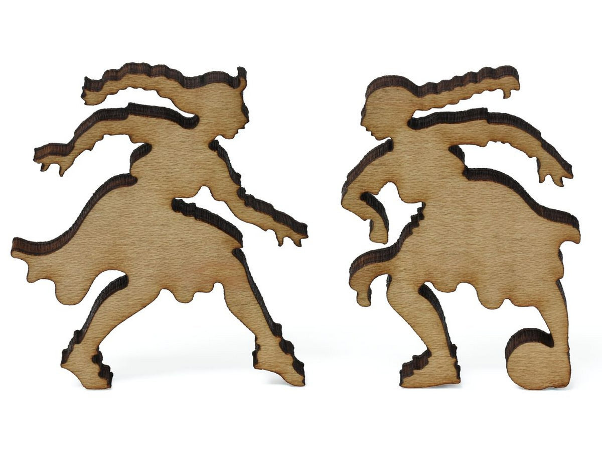 A closeup of pieces showing two children playing soccer.