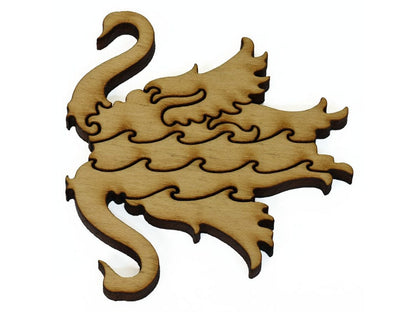 A closeup of pieces showing a swan swimming alongside its reflection in the water.
