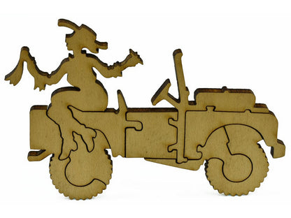 A closeup of pieces that make up a multi-piece jeep with a woman sitting on it.