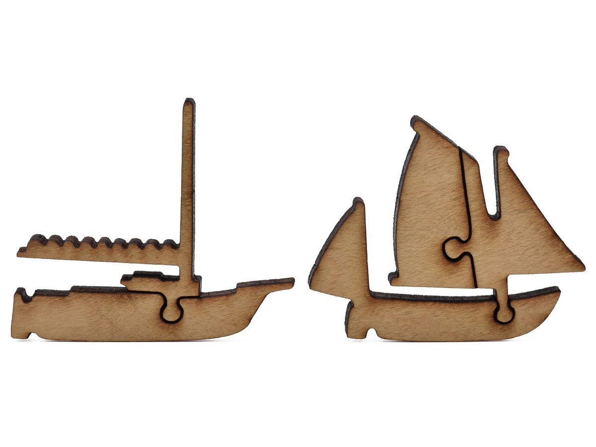 A closeup of pieces shaped like two boats.