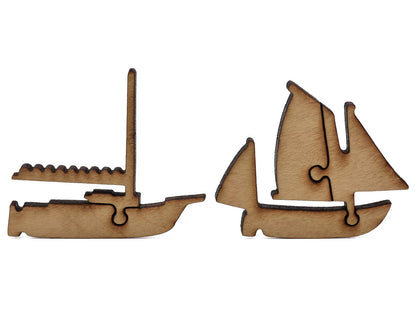 A closeup of pieces shaped like two boats.