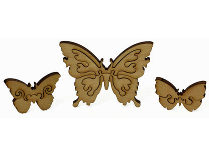 A closeup of pieces showing a big butterfly and two smaller ones.