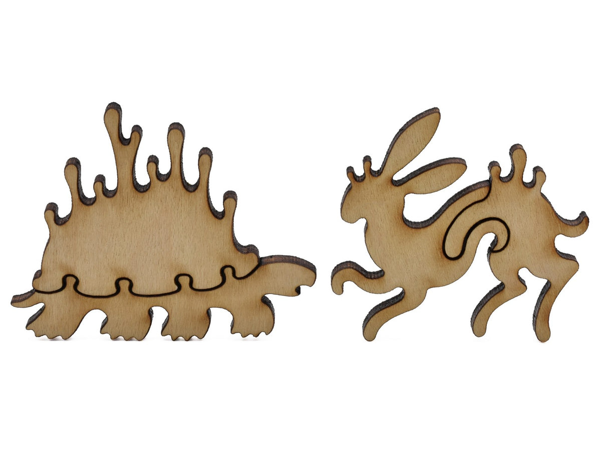 A closeup of pieces shaped like a whimsical turtle and rabbit.