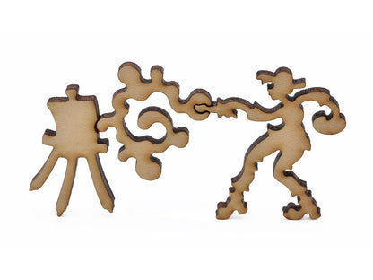 A closeup of pieces in the shape of an artist painting.