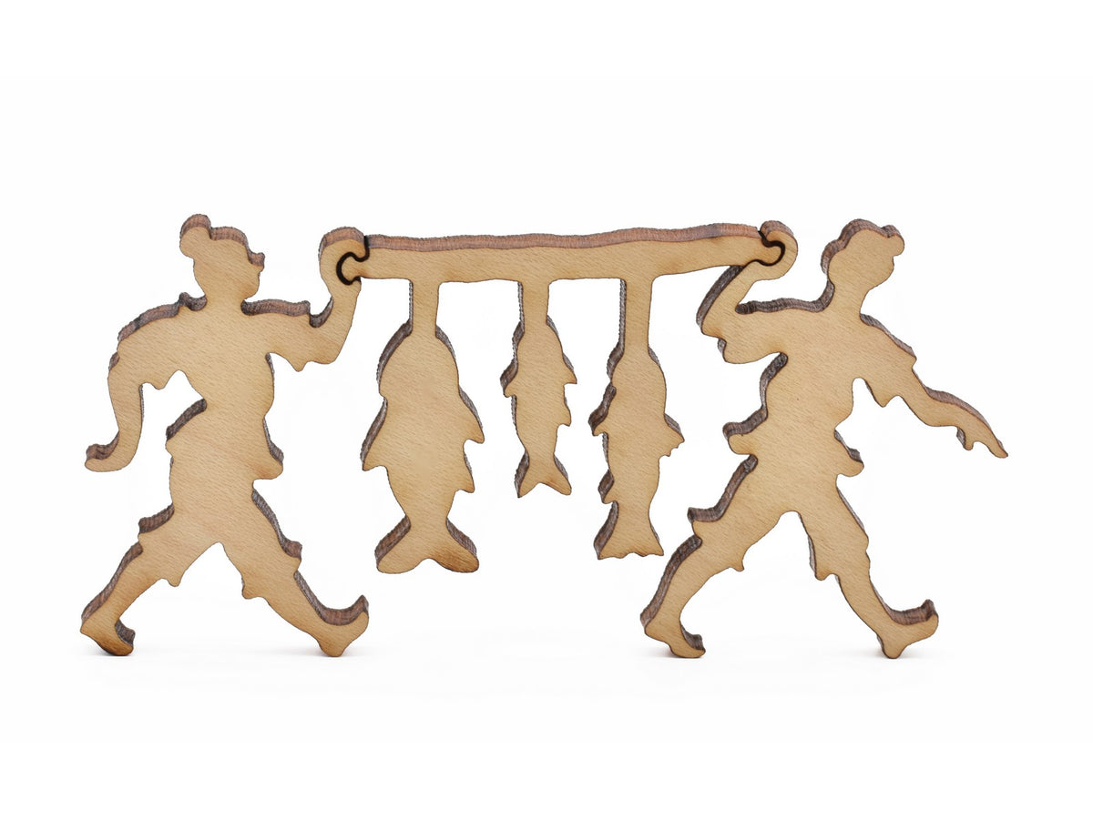 A closeup of pieces in the shape of fishermen.