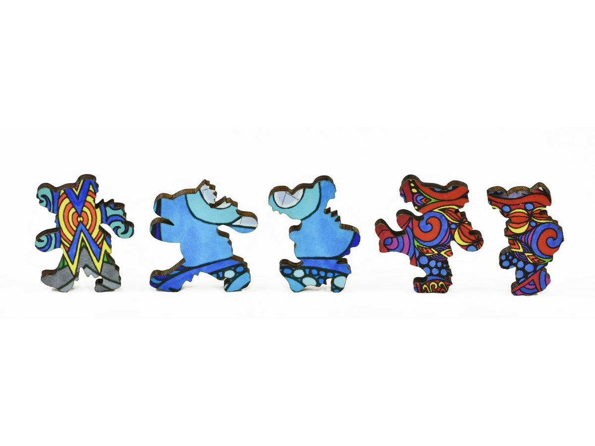 A closeup of pieces in the shape of dancing bears.