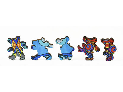 A closeup of pieces in the shape of dancing bears.
