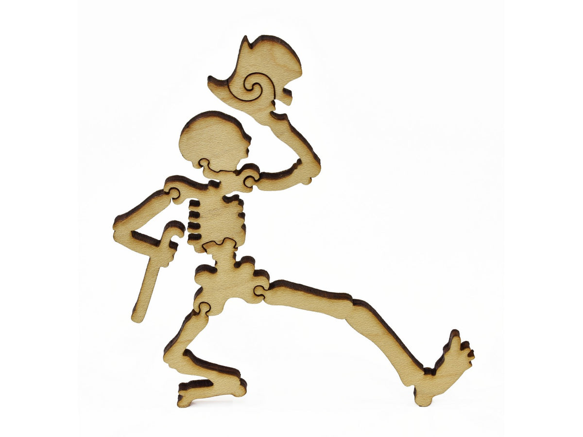 A closeup of pieces in the shape of a dancing skeleton.