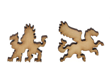 A closeup of pieces in the shape of a griffin and a winged horse.