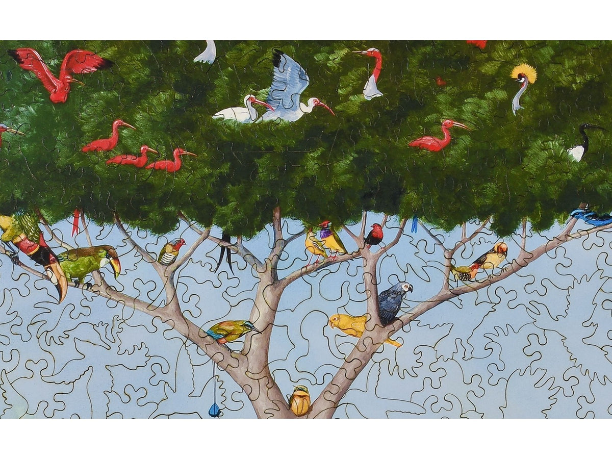 A closeup of the front of the puzzle, A Good Tree Can Lodge Ten Thousand Birds, showing the detail in the pieces.