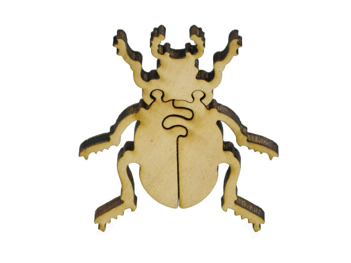 A closeup of pieces in the shape of a beetle.