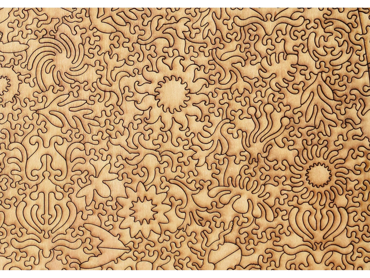 A closeup of the back of the puzzle, Bug Garden Terrarium, showing the detail in the pieces.