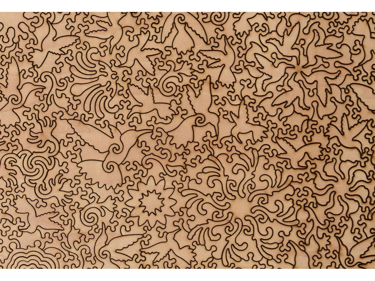 A closeup of the back of the puzzle, A Charm of Hummingbirds, showing the detail in the pieces.