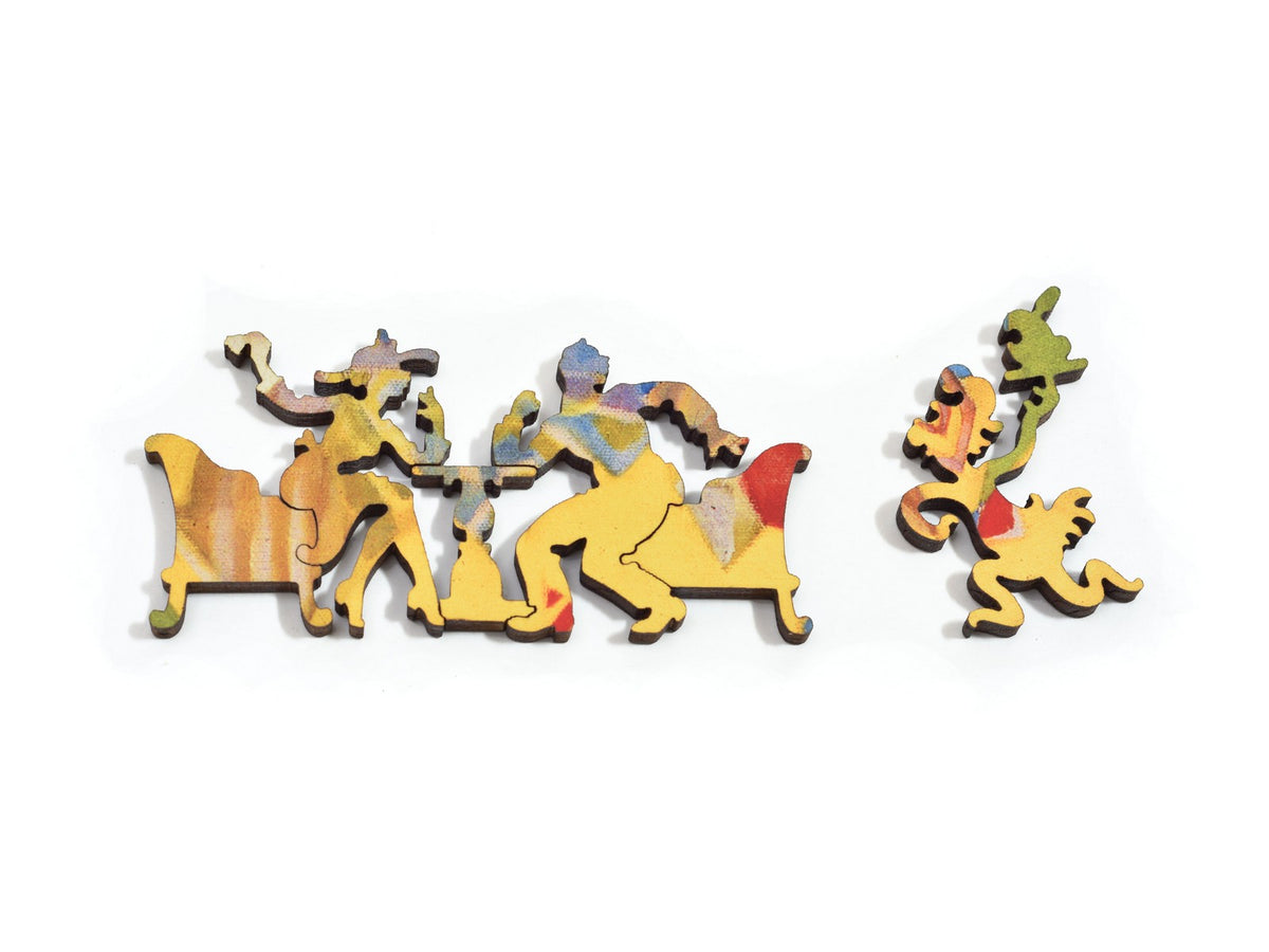 A closeup of pieces in the shape of a couple at a table and a waiter.