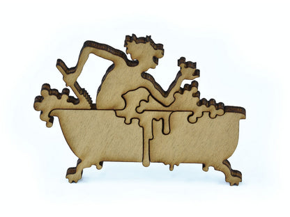 A closeup of pieces in the shape of a man in a bathtub.
