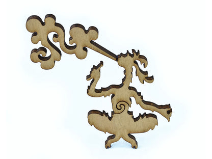 A closeup of pieces in the shape of a creature smoking.