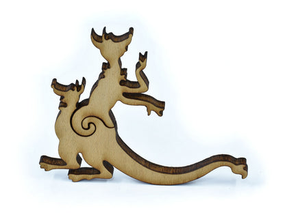 A closeup of pieces in the shape of a kangaroo with a joey.